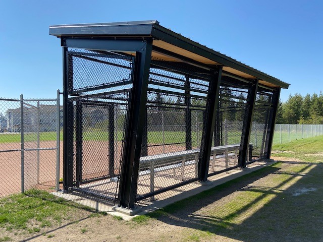 Photo of a chain link dugout recently installed in 2024