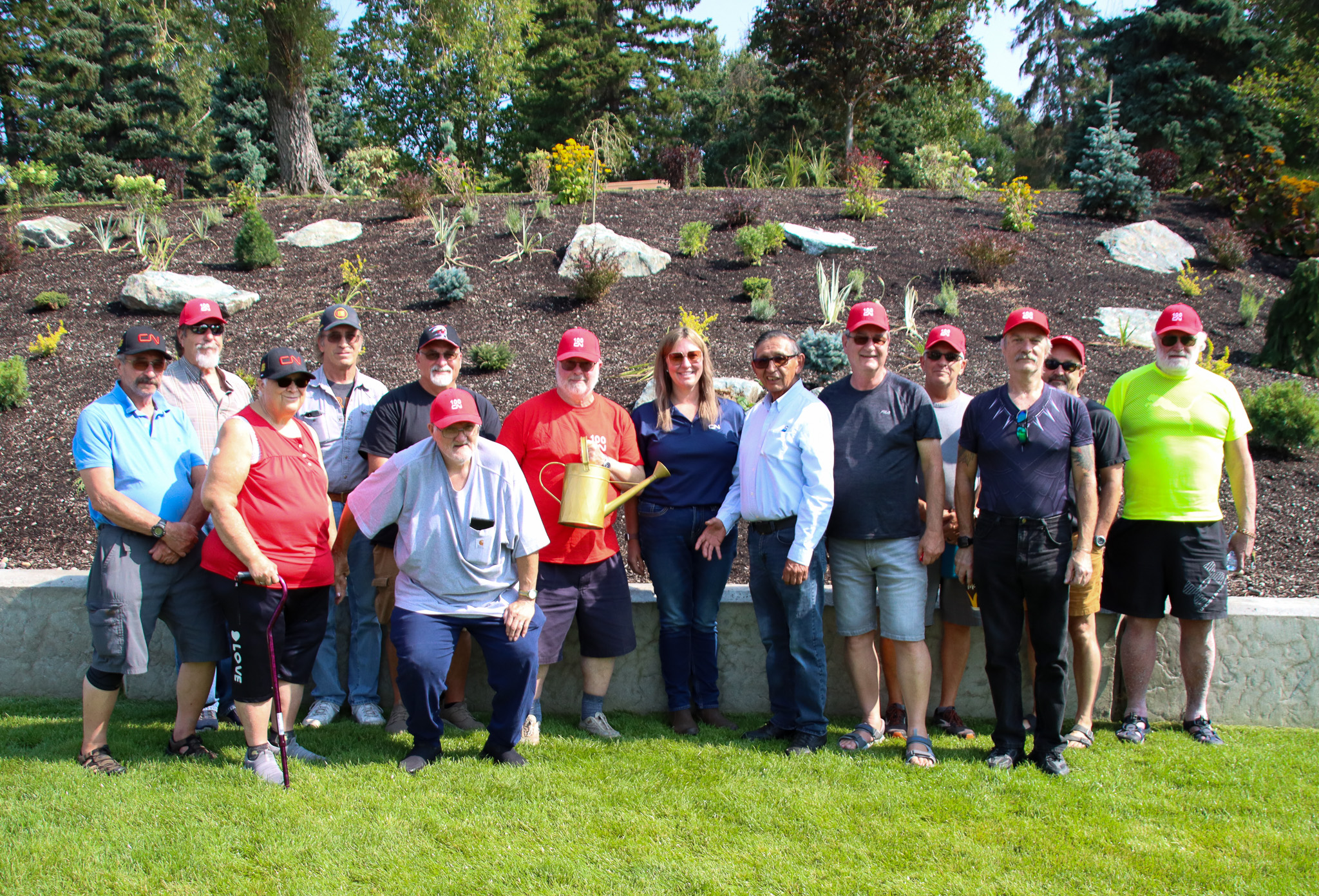 CN Centre pensioners, CN manager, and Elder Quaw in front of the new gardens