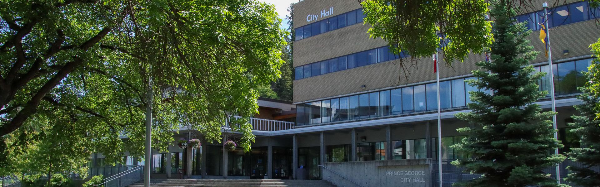 Prince George City Hall exterior with trees in the foreground