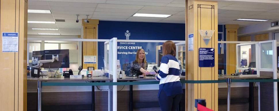 Resident being served by a Service Centre representative at City Hall.