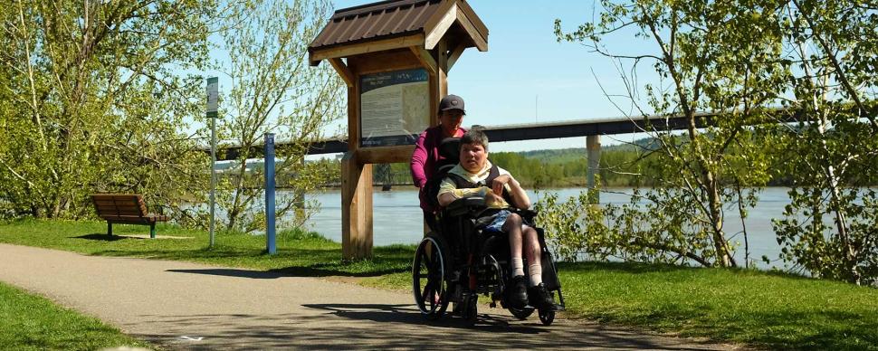 Resident in wheelchair visiting the Heritage River Trail.