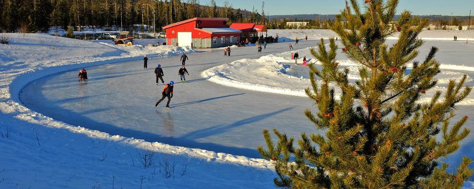 Skaters using the Prince George Ice Oval on a winter day.