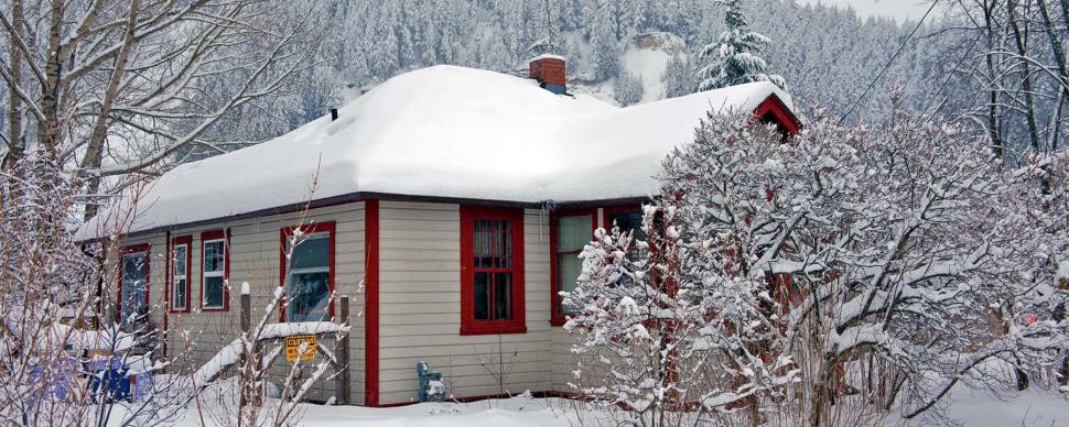 The Howieson house heritage property covered with snow on a winter day.