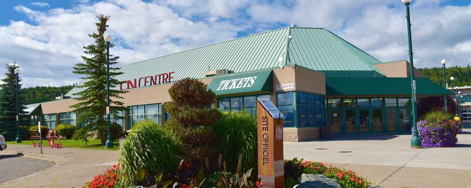 The outside of the CN Centre with blooming flowers in spring.