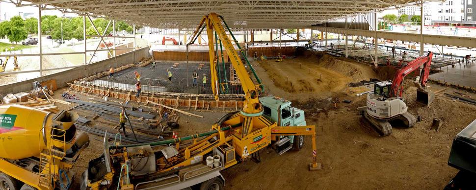 Construction vehicles working on the inside of the Canfor Leisure Pool.
