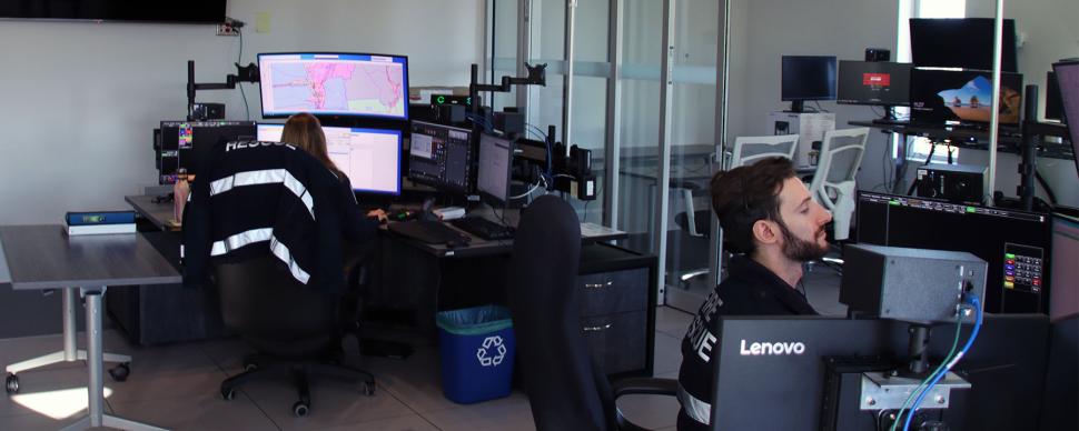 Fire dispatchers working at their computers at Fire Hall #1's dispatch centre.
