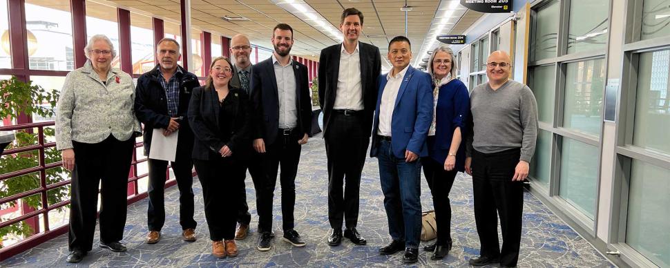 Mayor Simon Yu and city councillors pose with Premier David Eby following a meeting at the Prince George Conference and Civic Centre