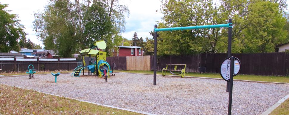 Yellow and green playground equipment for younger children and toddlers