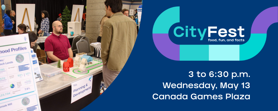 A person at a booth surrounded by informational signage. Text reads: CityFest. May 13. Canada Games Plaza.