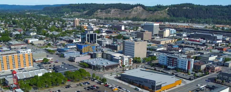 Aerial view of downtown Prince George with the cutbanks in the background